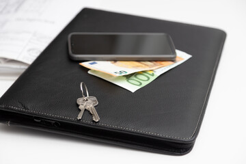 Coins, house key wallet and house drawing on the table. Crime for rent payment. Make money by business idea concept image close up. Concept image of buying a house