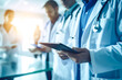 © Elena - Unrecognizables team of doctors reviewing patient's chart. Generative AI.