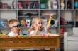 © BillionPhotos.com - School boy dreaming with alarm clock in classroom