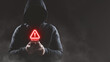 © TimmyTimTim - Hacker wear hood holding smartphone with red warning icon to launch ransomware malware attack on victim. Cyber security protection and hacking concept.