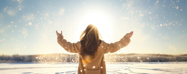 Happy young woman spread arms in snowy winter country. wide banner