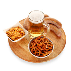 Mug of cold beer and different snacks on white background. Oktoberfest celebration