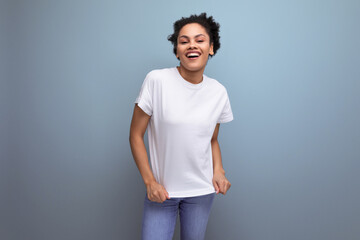 Wall Mural - young latin brunette student woman in white t-shirt with space for id print. branding concept