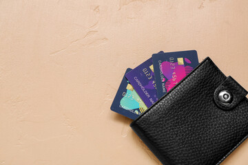 Poster - Leather wallet with credit cards on brown background