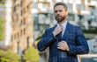 © be free - business employee on urban background, advertisement. business employee wearing jacket