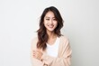 © Robert MEYNER - Beautiful asian woman smiling and looking at camera on white background