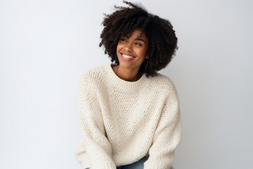 Wall Mural - Portrait of a beautiful young african american woman smiling against white background