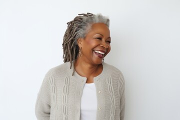 Canvas Print - Portrait of a happy african american woman smiling against white background