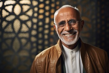 Medium shot portrait photography of a pleased Saudi Arabian man in his 60s wearing a chic cardigan against an abstract background 