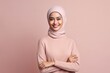 © Leon Waltz - Portrait of happy asian muslim woman in hijab smiling at camera