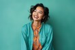 © Eber Braun - Portrait of a smiling young asian woman looking away isolated over green background