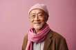 © Leon Waltz - Portrait of a senior asian man wearing winter clothes isolated over pink background