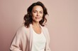 © Leon Waltz - Medium shot portrait photography of a happy Russian woman in her 40s wearing a chic cardigan against a pastel or soft colors background