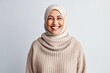 © Anne Schaum - Portrait of a happy muslim woman wearing hijab over white background