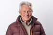 © Robert MEYNER - Portrait of a senior man in a warm jacket on a white background