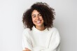© Robert MEYNER - Lifestyle portrait photography of a pleased Brazilian woman in her 30s wearing a cozy sweater against a white background