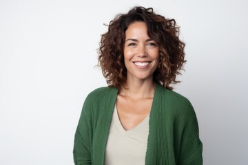 Lifestyle portrait photography of a satisfied Brazilian woman in her 30s wearing a chic cardigan against a white background 