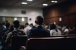 © Margo_Alexa - Rear view of unrecognizable people in the audience sitting at a lecture or meeting at the university. business and entrepreneurship or learning concept. Generative AI