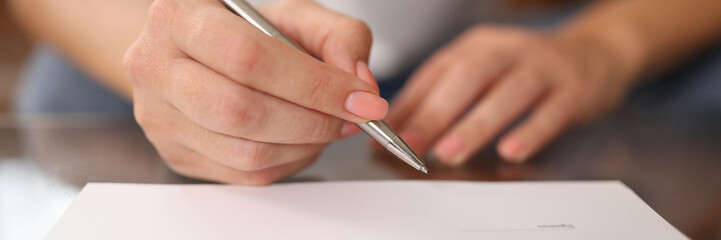 Wall Mural - Woman signs contract or agreement close-up.