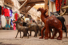 Camel And Other Animal Wooden Sculptures Displayed In A Shop