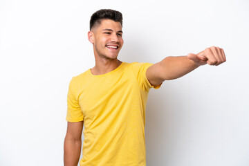 Wall Mural - Young caucasian man isolated on white background giving a thumbs up gesture