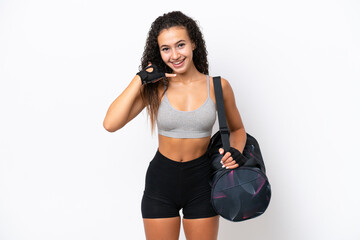 Wall Mural - Young sport Arab woman with sport bag isolated on white background making phone gesture. Call me back sign