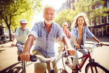 Group Of Elderly Tourists Cycling In Amsterdam