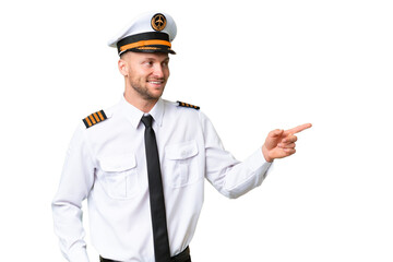 Wall Mural - Airplane pilot man over isolated background pointing finger to the side and presenting a product