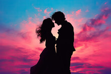 Silhouette Of A Couple Sharing A Kiss Against A Colourful Sunset