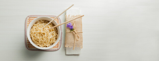 Ramen noodles in a bowl and chopsticks. Ramen concept. Noodle concept.