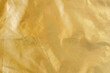 Golden background with copy space, raincoat fabric backdrop