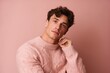 © Markus Schröder - Medium shot portrait photography of a satisfied boy in his 20s wearing a cozy sweater against a dusty rose background. With generative AI technology