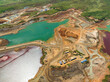 Aerial perspective of lake with polluted water in a nickel mine. Green and burgundy water color. Mindanao, Philippines.