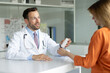 © Home-stock - Doctor man prescribing medications to female patient after check up in clinic, male therapist giving vitamins to young woman