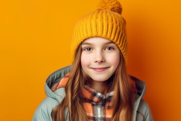 Wall Mural - Close-up portrait photography of a satisfied kid female wearing a warm beanie against a bright yellow background. With generative AI technology