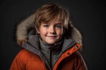 Wall Mural - Environmental portrait photography of a glad kid male wearing a warm parka against a dark grey background. With generative AI technology