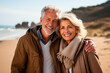 © Victor - Couple of pensioners walking along the beach one autumn morning