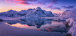 Beautiful winter landscapes in Lofoten islands, Northern Norway. wintry season. Amazing winter nature scenery. Fantastic colorful sunset over north fjord above snow covered mountains. Norway