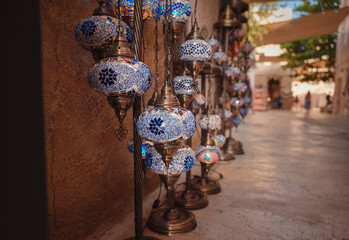 Wall Mural - Al seef old historical district with traditional Arabic architecture. Beautiful Traditional Ramadan Light Lamp in shop Dubai Spice Souk.