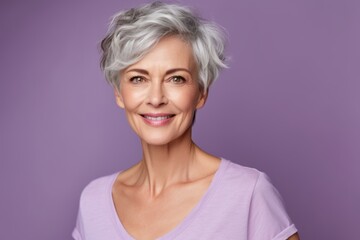 Wall Mural - Close-up portrait photography of a tender mature woman wearing a casual short-sleeve shirt against a lilac purple background. With generative AI technology