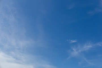 Wall Mural - beautiful blue sky background, white clouds covering thinly spread the sky