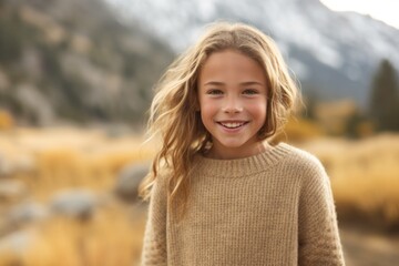 Wall Mural - Urban fashion portrait photography of a grinning kid female wearing a cozy sweater against a scenic mountain trail background. With generative AI technology