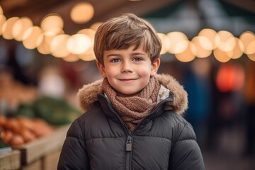 Wall Mural - Studio portrait photography of a happy kid male wearing a cozy winter coat against a bustling farmer's market background. With generative AI technology