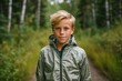 © Markus Schröder - Lifestyle portrait photography of a tender mature boy wearing a lightweight windbreaker against a serene nature trail background. With generative AI technology