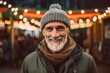 © Markus Schröder - Headshot portrait photography of a satisfied mature man wearing a warm beanie or knit hat against a lively festival ground background. With generative AI technology