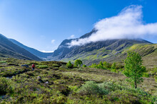 Hikers Walking Towards Ben Nevis In Scotland United Kingdom Hiking Via The North Face Route