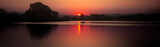 Fototapeta Kwiaty - Zachód słońca nad jeziorem
