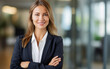 © Keitma - Smiling elegant confident young professional business woman , female proud leader, smart businesswoman lawyer or company manager executive looking at camera standing in office