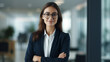 © Keitma - Smiling elegant confident young professional business woman , female proud leader, smart businesswoman lawyer or company manager executive looking at camera standing in office