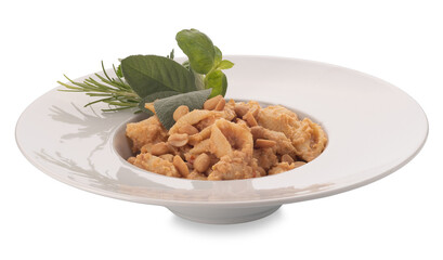 Wall Mural - Macaroni conchiglioni served with peanut and tomato pesto. Italian shell-shaped pasta with basil, sage and rosemary leaves in white dish isolated